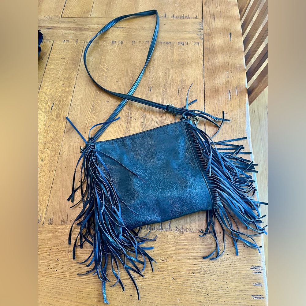 Carlos Santana black fringed crossbody bag. Zipper.